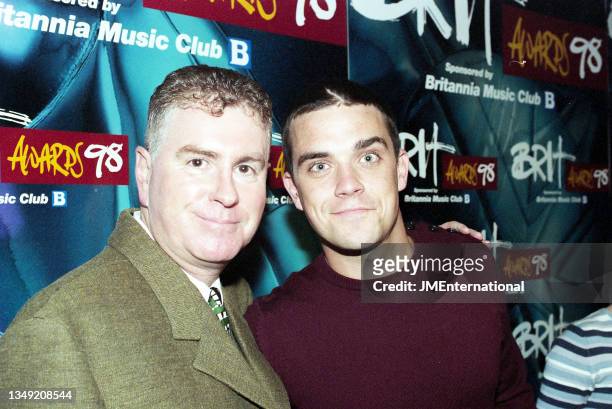 Paul Conroy and Robbie Williams attend The BRIT Awards Nominations Launch 1998, CafÈ De Paris, London, UK, Monday 12 January 1998.