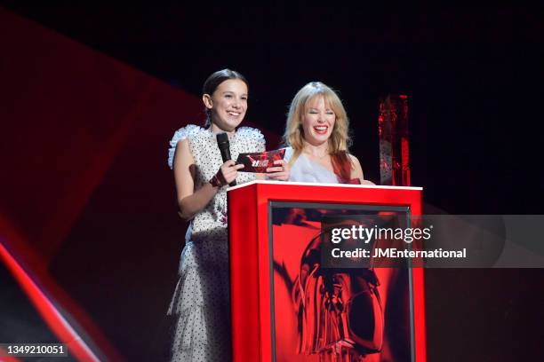 Millie Bobby and Kylie Minogue on stage to present the British Female Solo Artist award during The BRIT Awards 2018 Show, The O2, London, UK,...