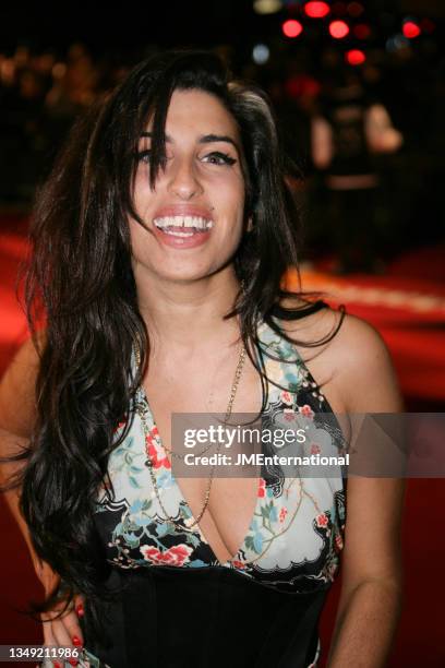 Amy Winehouse poses on the red carpet during The 25th BRIT Awards 2005 with Mastercard, Earls Court Exhibition Centre, London, UK, Wednesday 09...