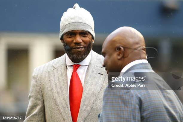 Analysts Randy Moss and Booger McFarland look on before a game between the Seattle Seahawks and New Orleans Saints at Lumen Field on October 25, 2021...