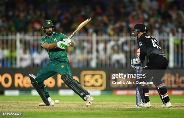 Imad Wasim of Pakistan plays a shot as Tim Seifert of New Zealand looks on during the ICC Men's T20 World Cup match between Pakistan and New Zealand...