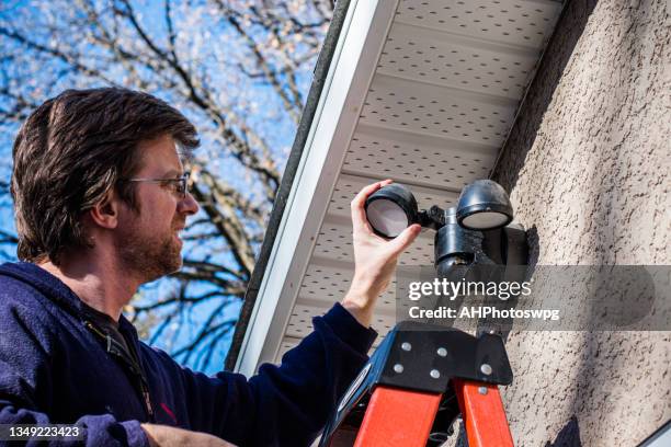 investigating light - fitting stockfoto's en -beelden