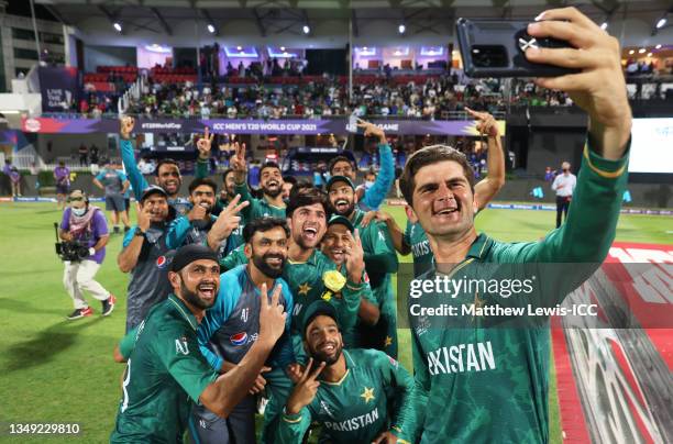 Shaheen Afridi of Pakistan poses for a selfie with their team mates following the ICC Men's T20 World Cup match between Pakistan and New Zealand at...