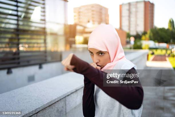focused muslim sportswoman shadow boxing - skuggboxning bildbanksfoton och bilder