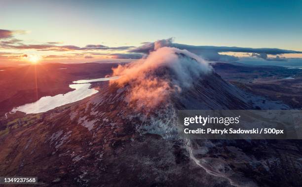 aerial view of volcanic landscape against sky during sunset,county donegal,ireland - republic of ireland stock pictures, royalty-free photos & images