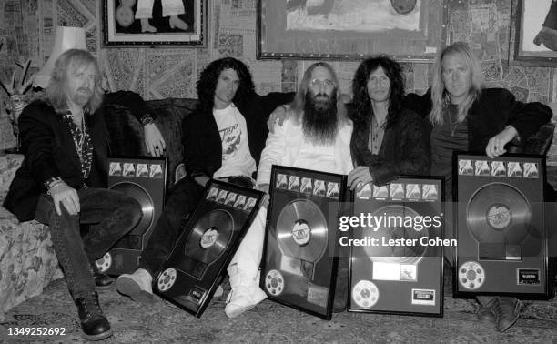 American guitarist Brad Whitford, American musician and songwriter Joe Perry, American singer, songwriter, musician and actor Steven Tyler and...