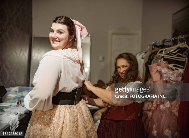 two actresses in period costume in dressing room - singer backstage stock pictures, royalty-free photos & images