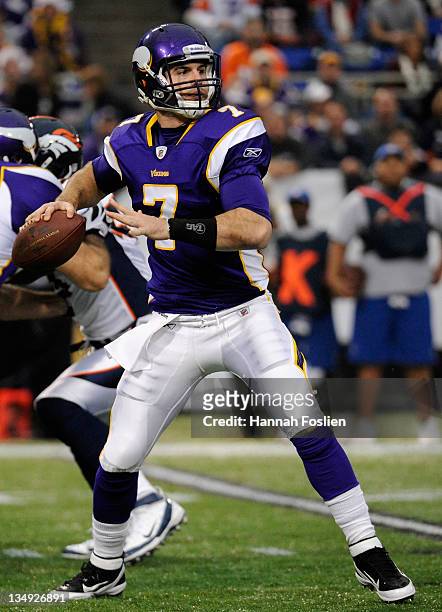 Christian Ponder of the Minnesota Vikings looks to pass against the Denver Broncos on December 4, 2011 at Mall of America Field at the Hubert H....