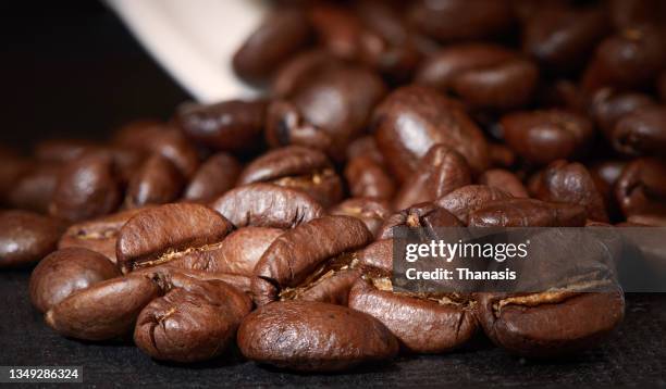 close-up of coffee beans - coffee capsules stock-fotos und bilder