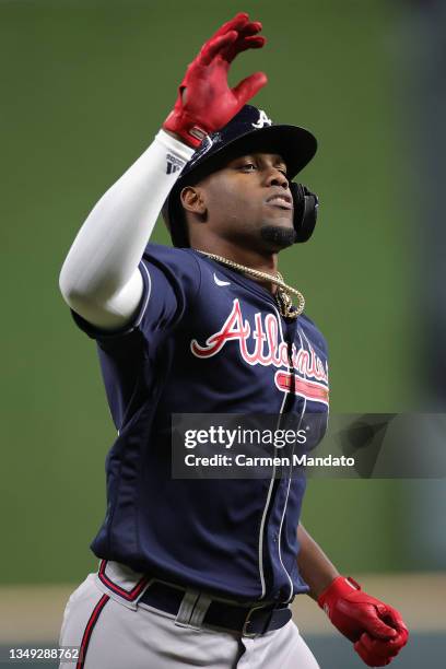 Jorge Soler of the Atlanta Braves celebrates after hitting a solo home run against the Houston Astros during the first inning in Game One of the...