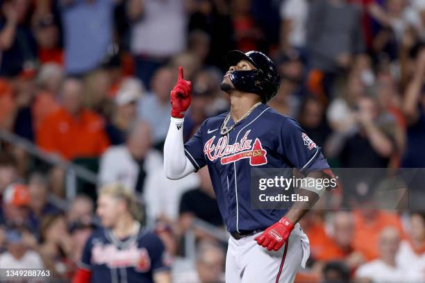 Jorge Soler of the Atlanta Braves celebrates after hitting a solo home run against the Houston Astros during the first inning in Game One of the...