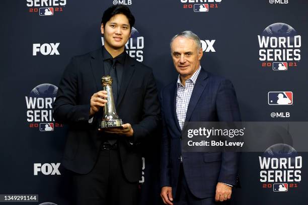 Major League Baseball Commissioner Rob Manfred presents Shohei Ohtani of the Los Angeles Angels with the Commissioner's Historic Achievement Award...