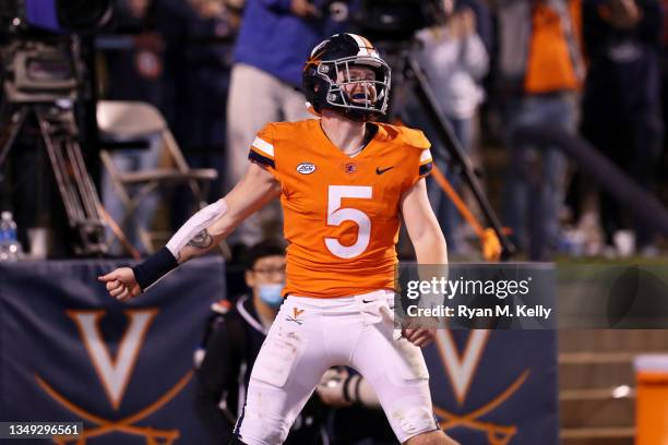 Brennan Armstrong of the Virginia Cavaliers celebrates a touchdown during a game against the Georgia Tech Yellow Jackets at Scott Stadium on October...