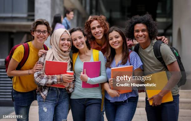multi-ethnic group of latin american college students smiling - emigration and immigration stock pictures, royalty-free photos & images