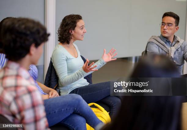 student talking in counseling group session at the university - bullying adults stock pictures, royalty-free photos & images