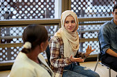 Muslim college students talking to a group in counseling