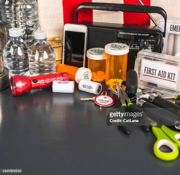 disaster preparation kit items on gray table with copy space - first aid kit bildbanksfoton och bilder