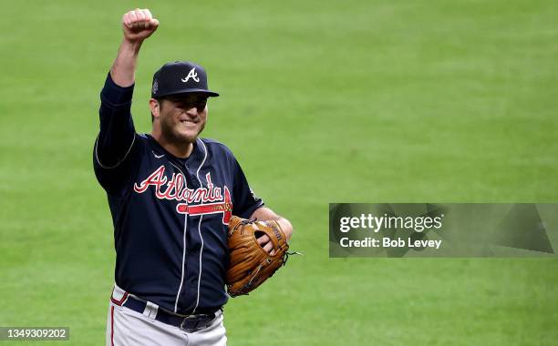 Luke Jackson of the Atlanta Braves celebrates after retiring the side during the seventh inning against the Houston Astros in Game One of the World...