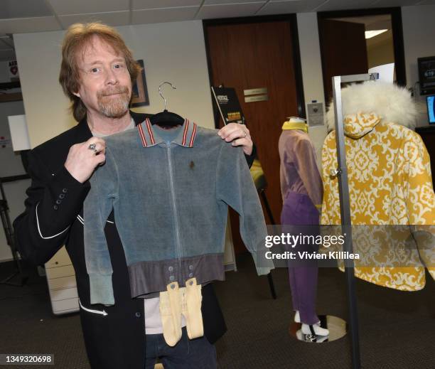 Bill Mumy poses with his tunic from season 1 of "Lost in Space" at the Auction Reception and Preview: Monsters & Friends: Featuring the Kevin Burns...