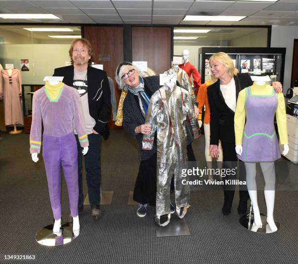 Bill Mumy, Angela Cartwright and Marta Kristen pose with their costumes from season 1 of "Lost in Space" at the Auction Reception and Preview:...
