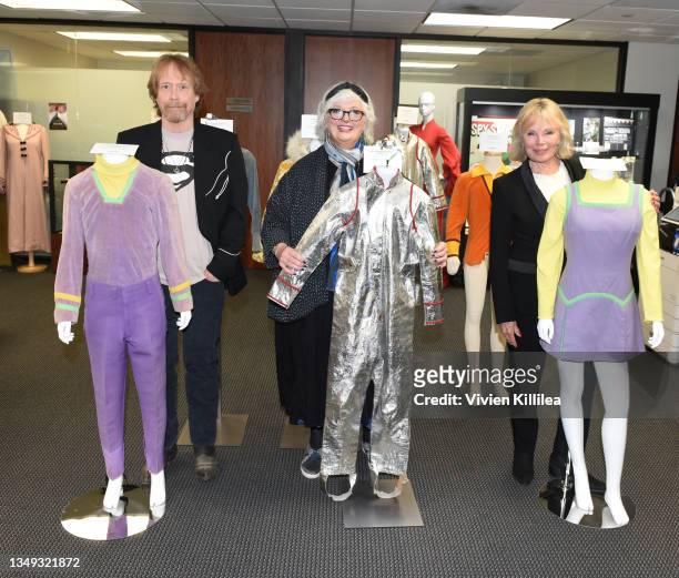 Bill Mumy, Angela Cartwright and Marta Kristen pose with their costumes from season 1 of "Lost in Space" at the Auction Reception and Preview:...