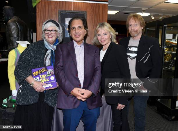 Angela Cartwright, John M. Azarian, Marta Kristen and Bill Mumy pose with memorabilia from "Lost in Space" at the Auction Reception and Preview:...