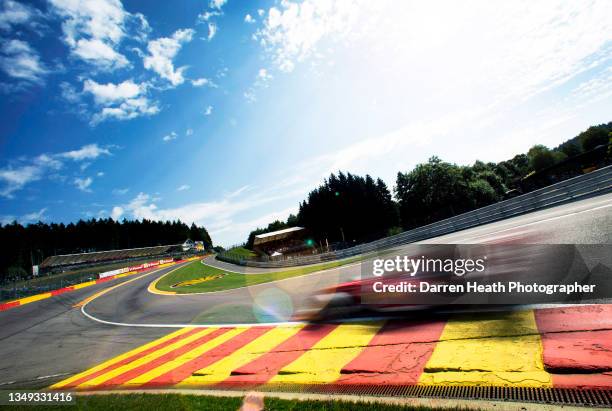 Brazilian Scuderia Ferrari Formula One team racing driver Felipe Massa driving his F138 racing car at speed through the Eau Rouge corner and over the...