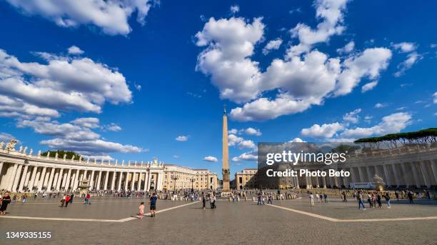 a wide angle view of the square of st. peter's basilica and bernini's colonnade the vatican - st peter's square stock pictures, royalty-free photos & images
