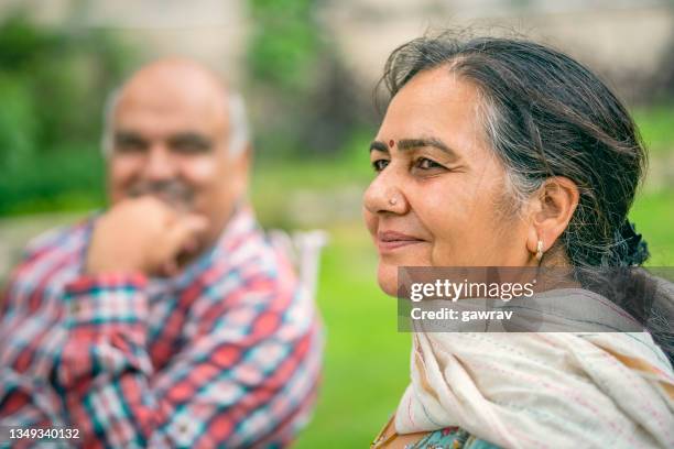 happy senior woman with her husband. - indian subcontinent ethnicity stock pictures, royalty-free photos & images