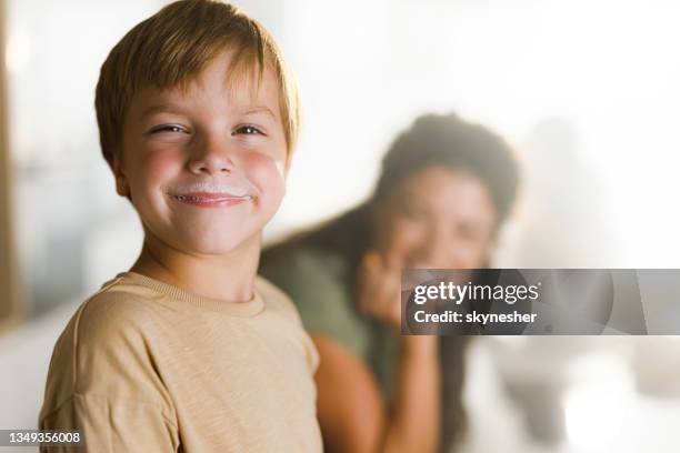 smiling little boy with milk mustaches in dining room. - bigode imagens e fotografias de stock