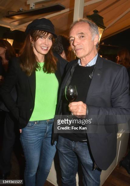 Actress Anne Parillaud and Salon du Livre et du Vin de Saumur funder Jean Maurice Belayche attend "Chronique D'un Dillettant" Jean Marie Perrier...