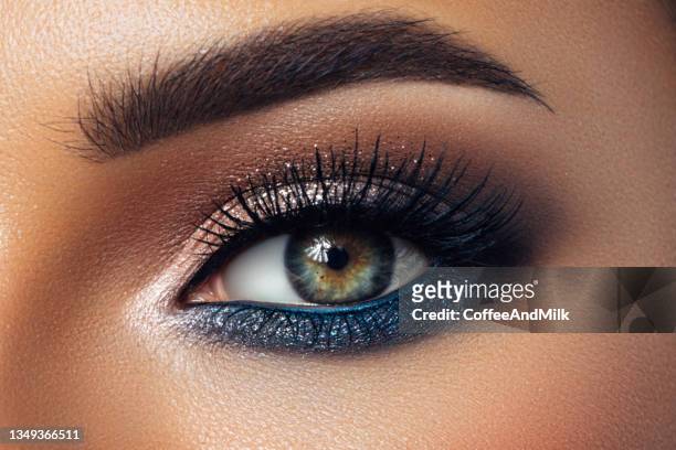 part of face of a beautiful woman with bright make-up - beautiful woman and eyeshadow stock pictures, royalty-free photos & images