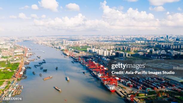 top view of deep water port with cargo ship and containers in shanghai. - docklands studio stock pictures, royalty-free photos & images