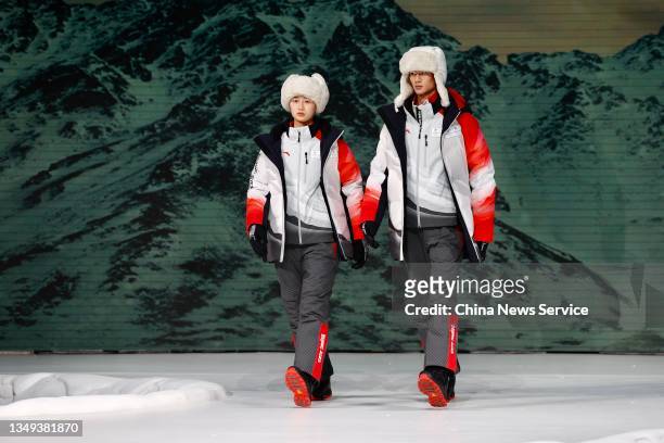 Models showcase uniforms and accouterments for technical officers during the release ceremony of uniforms and accouterments for Beijing 2022 Olympic...