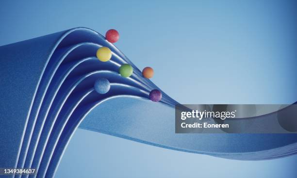 multi colored balls moving on the ribbons - together abstract stock pictures, royalty-free photos & images