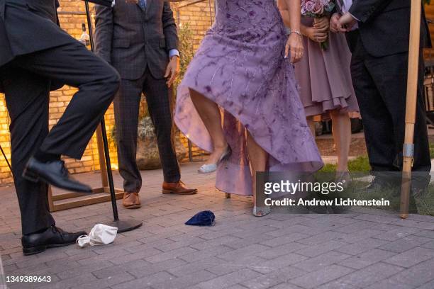 Couple break their own glass at a Jewish wedding in a slight departure from tradition, on October 21, 2021 in Bala Cynwyd, Pennsylvania.