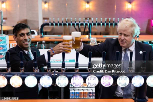 British Prime Minister Boris Johnson and Britain's Chancellor of the Exchequer Rishi Sunak visit 'Fourpure Brewery' in Bermondsey on October 27, 2021...