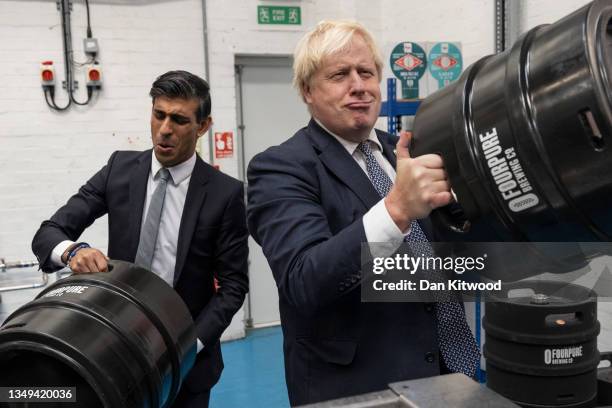 British Prime Minister Boris Johnson and Britain's Chancellor of the Exchequer Rishi Sunak visit 'Fourpure Brewery' in Bermondsey on October 27, 2021...