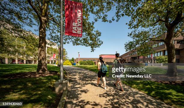 Students walk around the campus at Stony Brook University in Stony Brook, New York on Aug. 26, 2021.