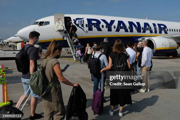 People board a Ryanair flight to Spain at Berlin Brandenburg Airport on September 02, 2021 in Berlin, Germany. Air travel is picking up again as fear...