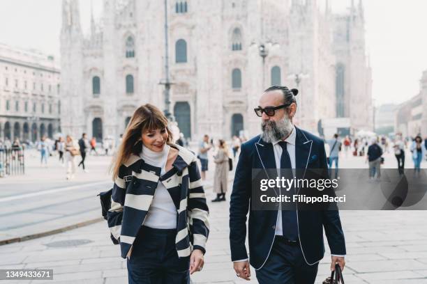 business people are walking in the city - piazza del duomo, milan - milan financial district stock pictures, royalty-free photos & images