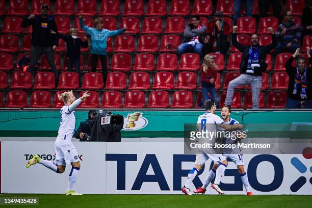 Lucas Cueto of Karlsruher SC celebrates his team's 1st goal with team mates during the DFB Cup second round match between Bayer Leverkusen and...