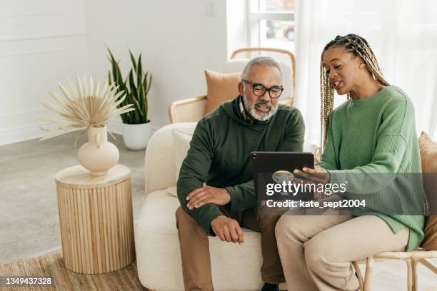 helping with tax planning - insurance agent with senior stock pictures, royalty-free photos & images