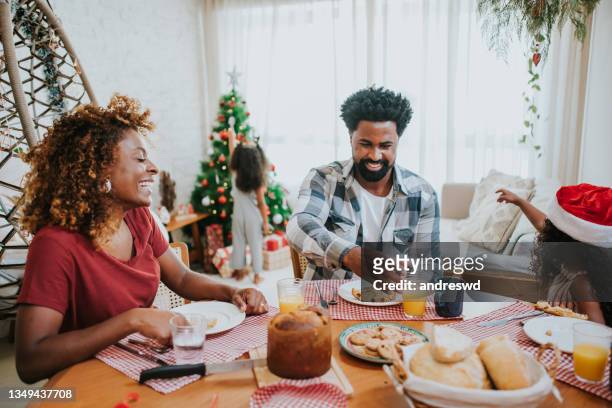 happy family celebrating christmas at home - christmas breakfast stock pictures, royalty-free photos & images