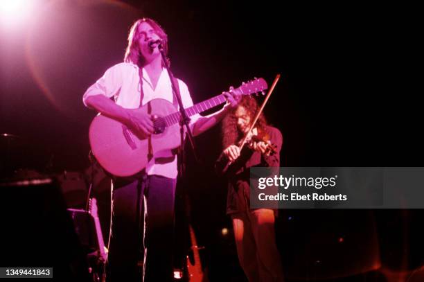 American Rock, Pop, and Folk musicians Jackson Browne , on acoustic guitar, and David Lindley, on violin, perform onstage at the Tanglewood Music...