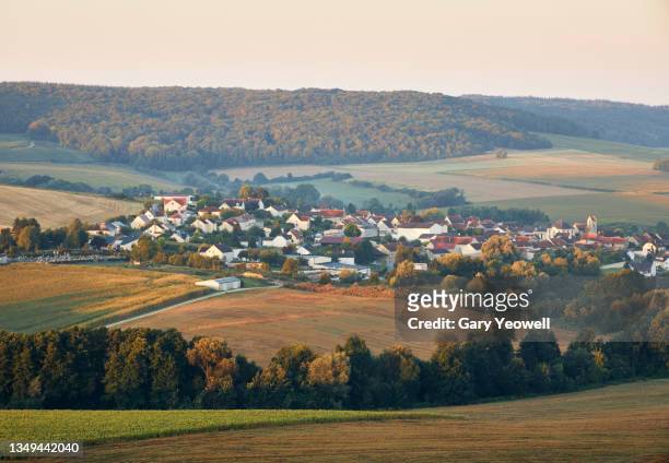 rural landscape and village in champagne region of france - aldea fotografías e imágenes de stock