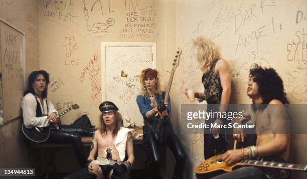 Izzy Stradlin, Axl Rose, Duff McKagan, Steven Adler and Slash of the rock group 'Guns n' Roses' pose for a portrait backstage at Fenders Ballroom on...