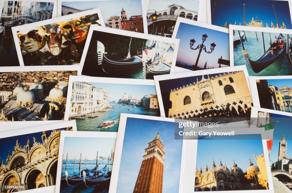 Collection of instant film travel holiday photos of Venice on a table