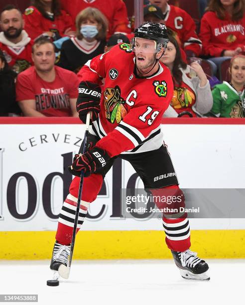 Jonathan Toews of the Chicago Blackhawks passes against the Detroit Red Wings at the United Center on October 24, 2021 in Chicago, Illinois. The Red...