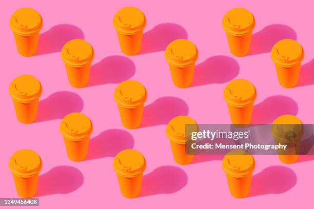 yellow coffee cup pop art pattern on a pink background - decaffeinated stock pictures, royalty-free photos & images